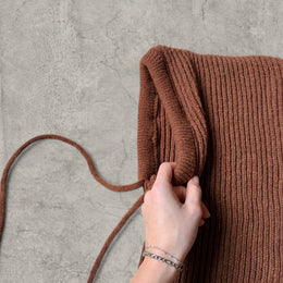 Knitted hooded snood scarf bonnet hat with drawstring in brown