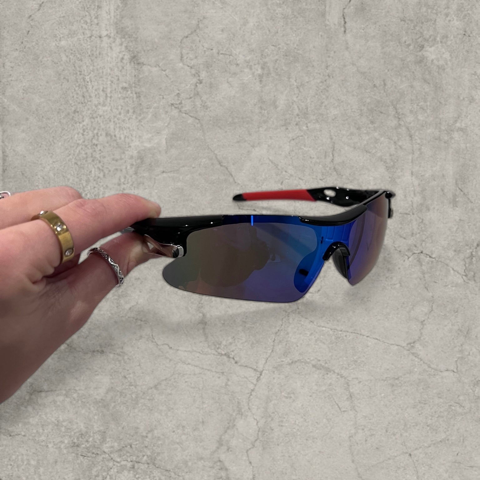 Sport sunglasses with blue and purple reflective lenses in black